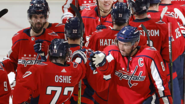 May 7, 2022; Washington, District of Columbia, USA;Washington Capitals left wing Alex Ovechkin (8) celebrates with Capitals right wing T.J. Oshie (77) after their game against the Florida Panthers in game three of the first round of the 2022 Stanley Cup Playoffs at Capital One Arena. Mandatory Credit: Geoff Burke-USA TODAY Sports